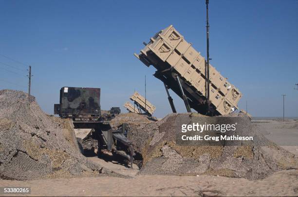 Cannisters containing Patriot missiles standing at the ready in remote desert location to intercept Iraqi Scud missiles fired at Saudi Arabia or its...