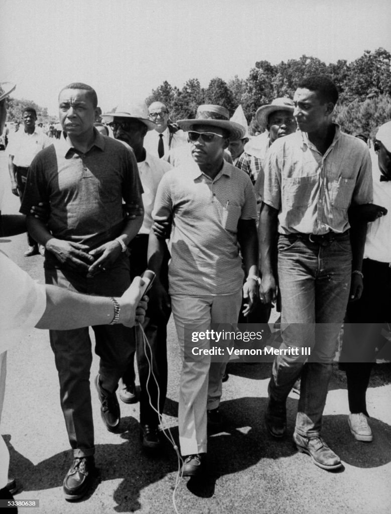 Civil rights leaders Floyd B. McKissick (fore, L),