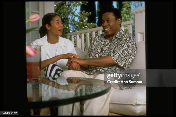 Jazz saxophonist Wayne Shorter chatting with his 35-yr-old daughter Miyako at home.