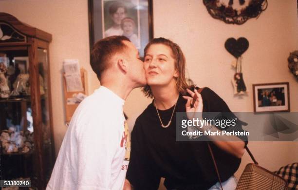 Aren Almon , mother of 1-yr-old Baylee killed in terrorist bombing of Alfred P. Murrah Federal Building, being kissed on the cheek by her fianc? Stan...