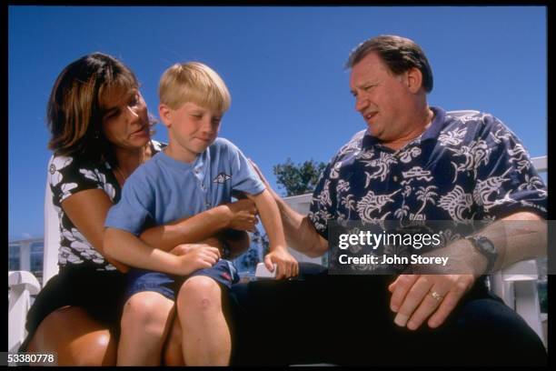 University of Hawaii football coach Fred vonAppen with wife Thea & son Cody whose life was saved on 3/29/1997 by placekicker Shannon Smith after Cody...