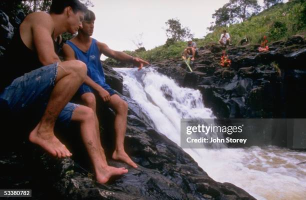 Brothers Ryan & Greg Smith at Waipahee waterfall on the island of Kauai where their brother, University of Hawaii football placekicker Shannon, died...