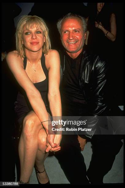 Rock star Courtney Love and designer Gianni Versace attending the fashion show of his Versus label.