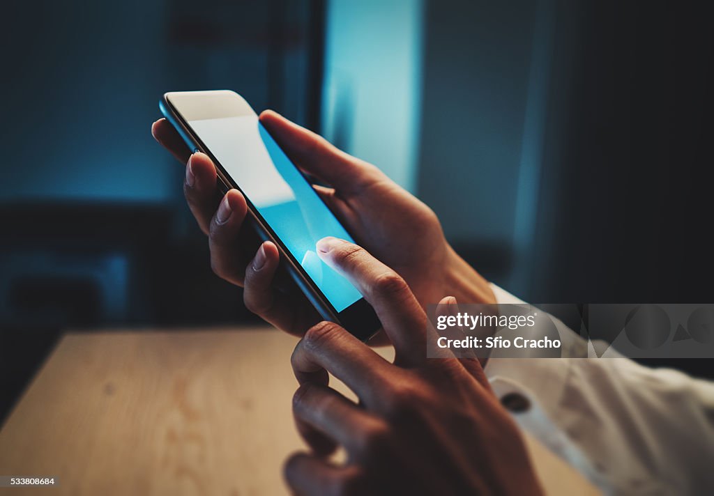 Close-up of female hand with smart phone