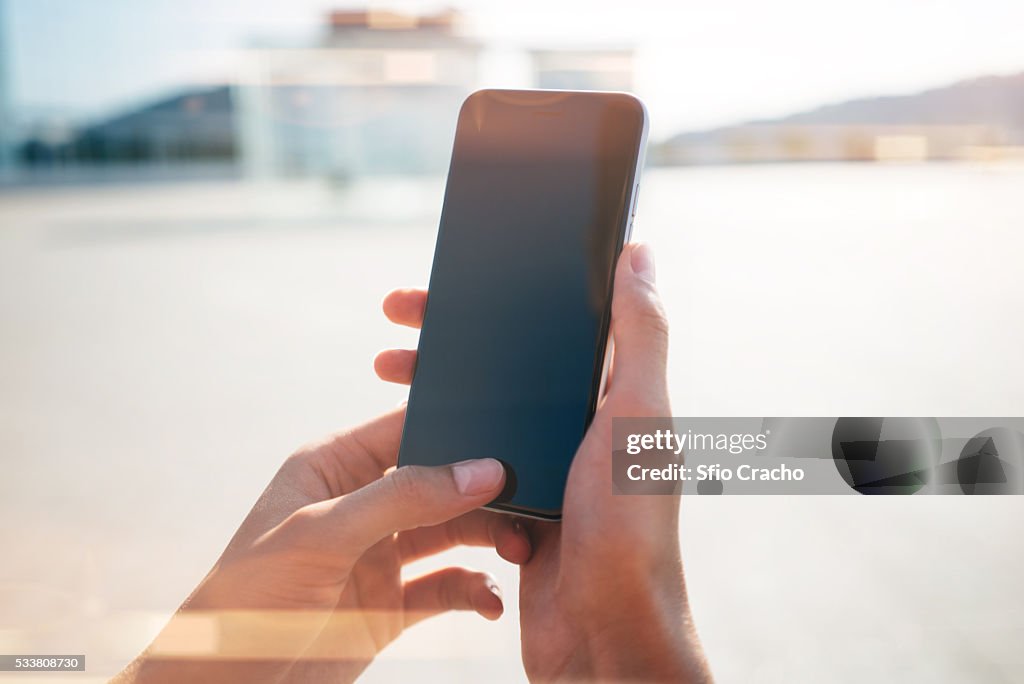 Close-up of a hand with smartphone