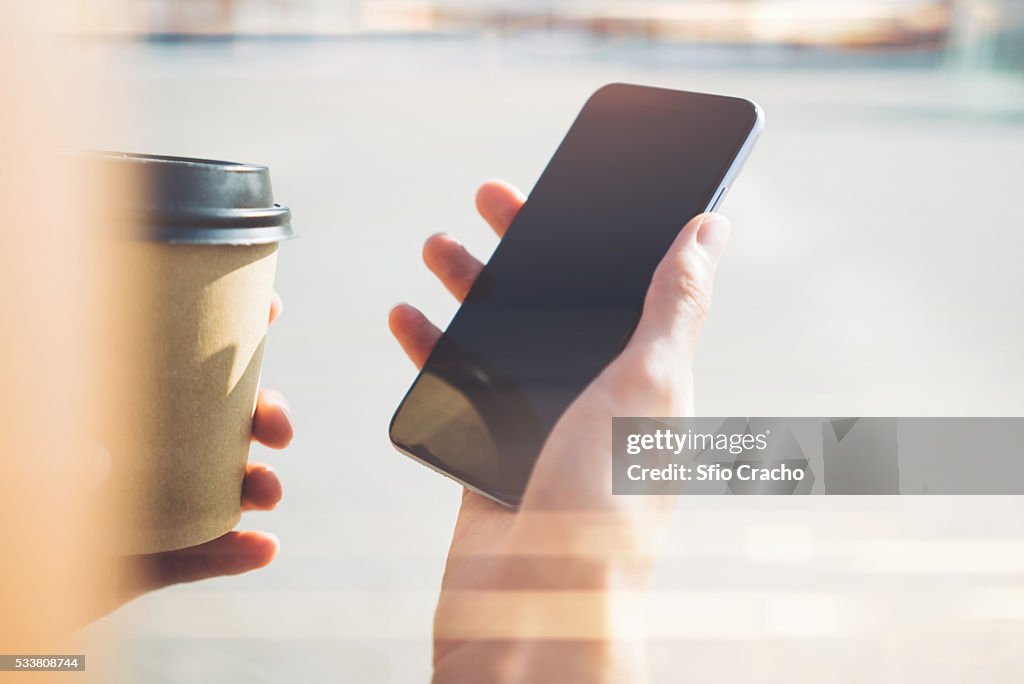 Close-up of a hand with smartphone