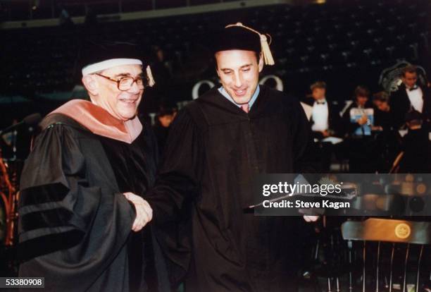 Today" show co-host Matt Lauer being congratulated for receiving his bachelor's degree from Ohio University 18 years after he was a student.