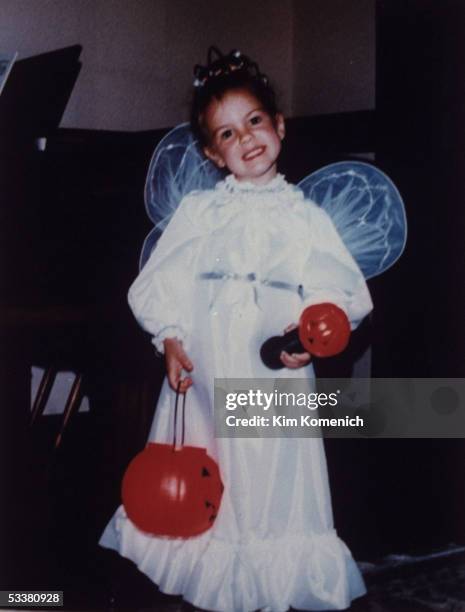 Future actress Larisa Oleynik dressed as an angel for Halloween.