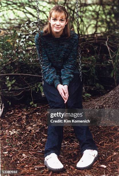 Actress Larisa Oleynik on a swing in her backyard.