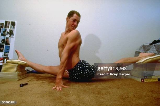 Bill May, only male member of the Santa Clara Aquamaids synchronized swim team, doing a split.