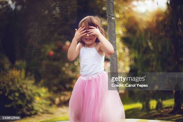 little princess with pink tutu covering face with hands - pink tiara stock pictures, royalty-free photos & images