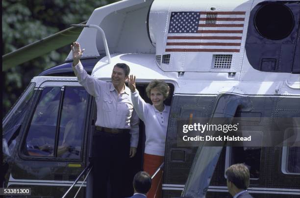 President Ronald with Reagan and his wife Nancy waving before boarding Marine One helicoptor for the July 4th holiday weekend at Camp David.