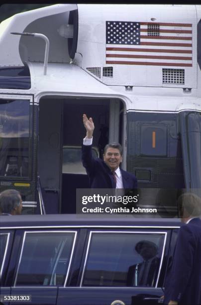 President Ronald with Reagan debarking Marine One on his way to the White House.