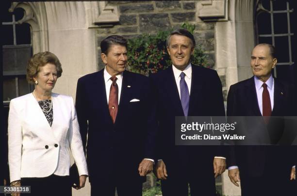 France's Francois Mitterrand , Canada's Prime Minister Brian Mulroney , US President Ronald with Reagan and Great Britain's Prime Minister Margaret...