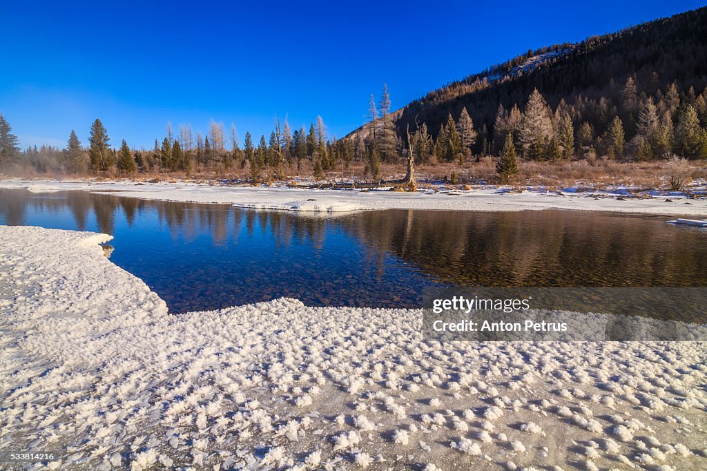 Winter landscape at dawn on the river