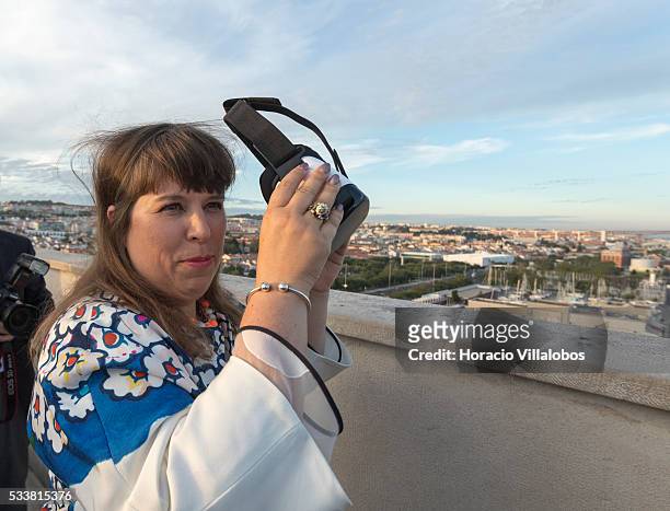 Portuguese artist Joana Vasconcelos tries virtual reality goggles at the top of the Padrao dos Descobrimentos during the public presentation of...