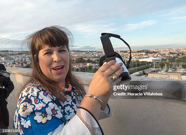 Portuguese artist Joana Vasconcelos tries virtual reality goggles at the top of the Padrao dos Descobrimentos during the public presentation of...