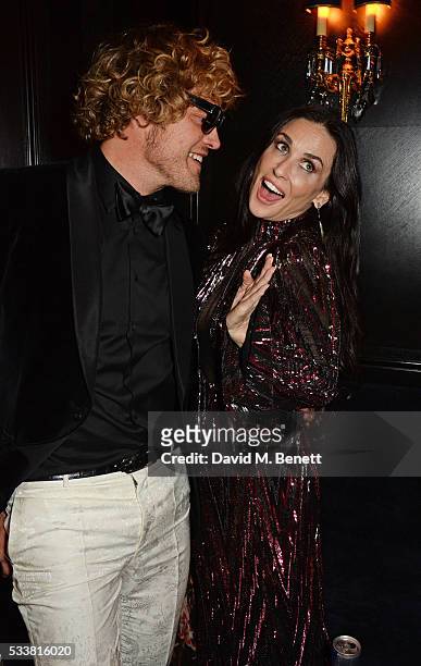 Peter Dundas and Demi Moore attend British Vogue's Centenary birthday party at Tramp on May 23, 2016 in London, England.