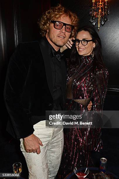 Peter Dundas and Demi Moore attend British Vogue's Centenary birthday party at Tramp on May 23, 2016 in London, England.