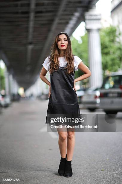 Sofya Benzakour , is wearing an Asos black dress, an Asos white t-shirt, and black shoes, during a street style session, on May 23, 2016 in Paris, .