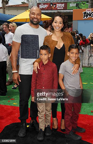 Derek Fisher, Gloria Govan and sons Carter Kelly Barnes and Isaiah Michael Barnes attend the premiere of "Angry Birds" at Regency Village Theatre on...