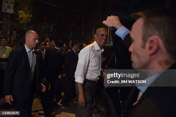 President Barack Obama departs after eating dinner at Bun cha Huong Lien with CNN's Anthony Bourdain in Hanoi late on May 23, 2016. Obama praised...