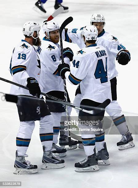 Tomas Hertl of the San Jose Sharks celebrates with Joe Thornton, Joe Pavelski, and Marc-Edouard Vlasic after scoring a first period goal against the...