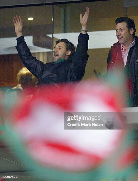 Nolan Stringer Russell Crowe celebrates a Rabbitohs try during the round 23 NRL ...