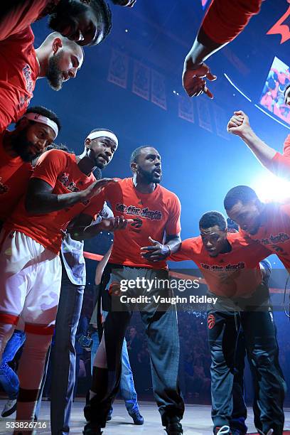 Patrick Patterson of the Toronto Raptors speaks to teammates as they huddle at the start of game four of the Eastern Conference Finals against the...