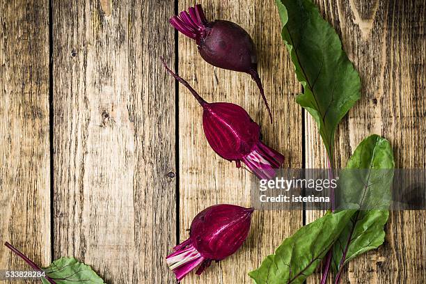 young spring beets with leaves on wooden table with copy space, overhead view - borsch stock pictures, royalty-free photos & images