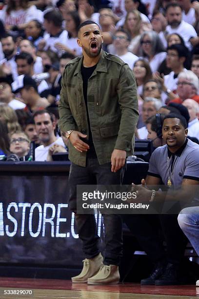 Rapper Drake reacts in the first quarter of game four of the Eastern Conference Finals between the Toronto Raptors and the Cleveland Cavaliers during...