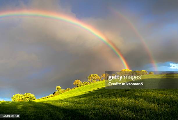 double rainbow landscape in beautiful  irish landscape scenery. - lumen field stockfoto's en -beelden