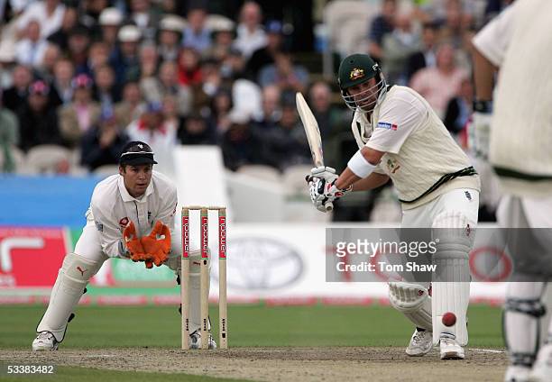 Shane Warne of Australia hits out watched by Geraint Jones of England during day three of the Third npower Ashes Test match between England and...