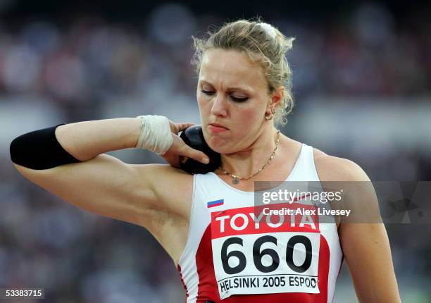 Olga Ryabinkina of Russia competes during women's Shot Put final at the 10th IAAF World Athletics Championships on August 13, 2005 in Helsinki,...