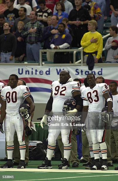 Dez White, Ted Washington, and David Terrell of the Chicago Bears observe the game against the Atlanta Falcons at the Georgia Dome in Atlanta,...