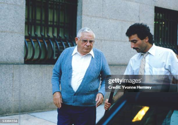 Anthony "Tony Ducks" Corallo, boss of the Luchese Crime Family, is helped to his car by his driver after leaving Federal Court during the Commission...