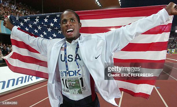 Gold medalist Dwight Phillips of USA celebrates after the men's long jump final at the 10th IAAF World Athletics Championships in Helsinki 13 August...