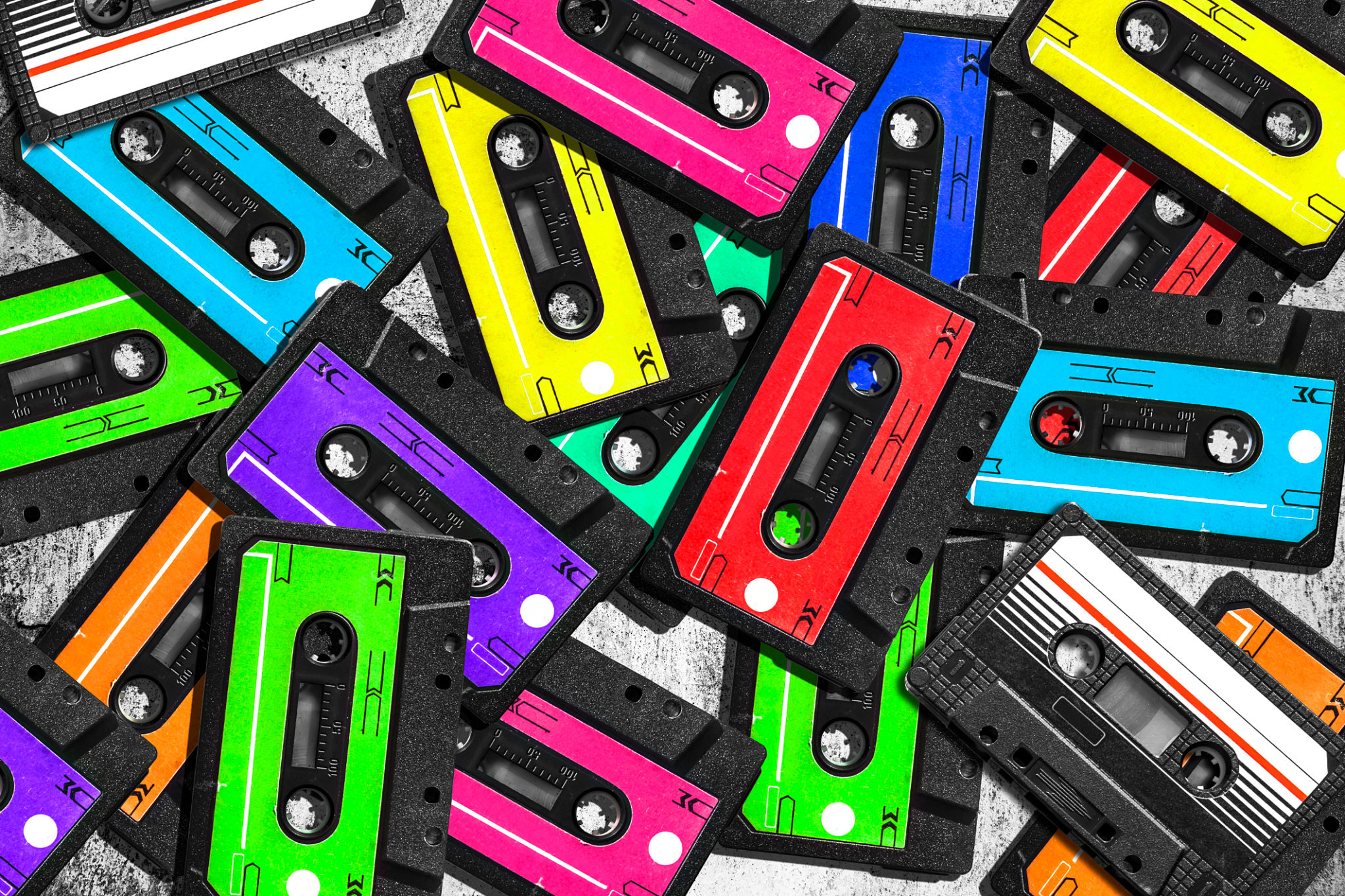 Old audio cassette. Multicolored audio tapes. Close-up view. Old audio cassette. Multicolored audio tapes. Close-up view.
