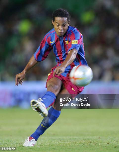 Ronaldinho of Barcelona scores a goal from a free kick against Real Betis during a Supercup first leg match between Real Betis and F.C. Barcelona at...