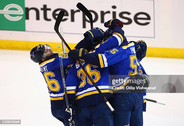 Robby Fabbri of the St. Louis Blues celebrates with teammates after scoring a second period goal against the San Jose Sharks in Game Five of the...