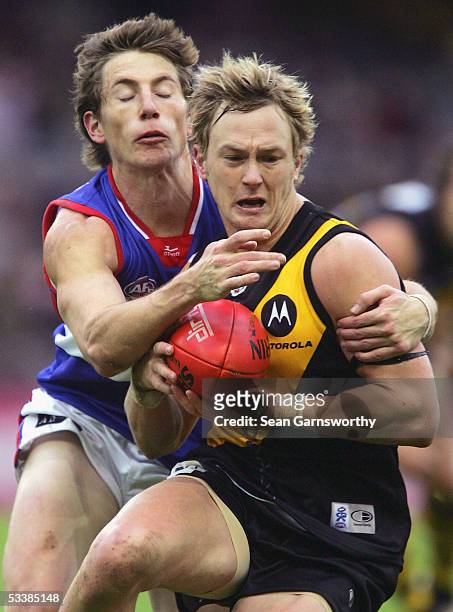 Kayne Pettifer for Richmond and Dale Morris for the Bulldogs in action during the AFL Round 20 match between the Richmond Tigers and Western Bulldogs...