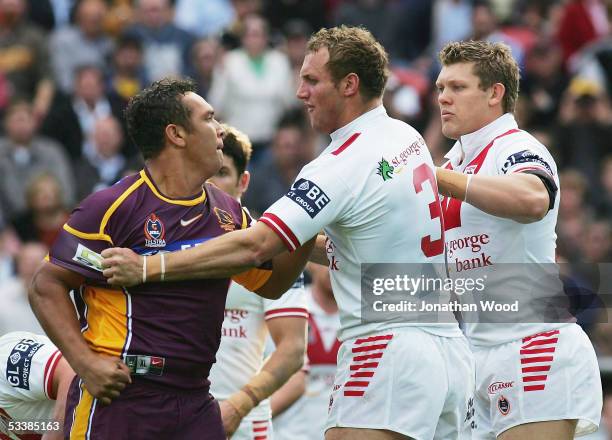 Mark Gasnier of the Dragons clashes with Neville Costigan of the Broncos during the round 23 NRL match between the Brisbane Broncos and St George...