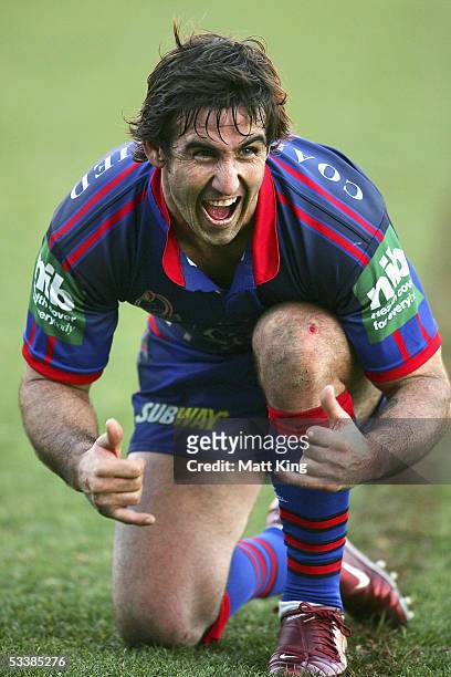 Andrew Johns of the Knights gestures to his son after the round 23 NRL match between the Newcastle Knights and the Manly Warringah Sea Eagles at...