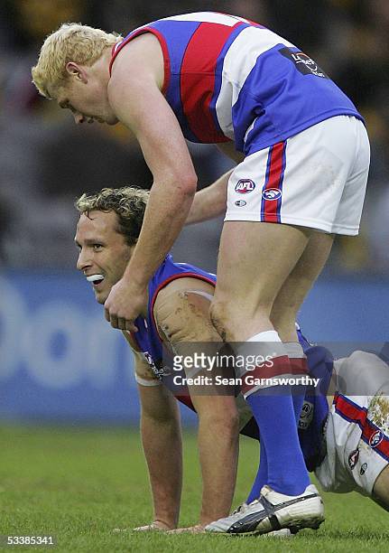 Adam Cooney and Mitch Hahn for the Bulldogs celebrate a goal during the AFL Round 20 match between the Richmond Tigers and Western Bulldogs at the...
