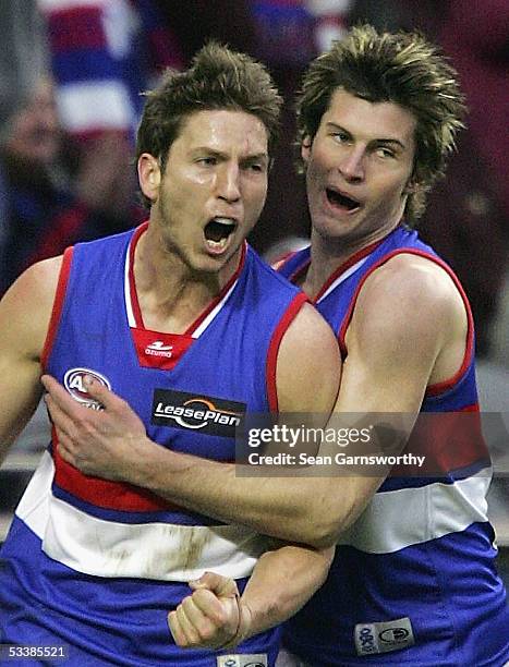 Matthew Boyd and Farren Ray for the Bulldogs celebrate a goal during the AFL Round 20 match between the Richmond Tigers and Western Bulldogs at the...