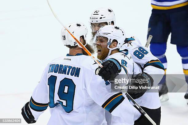 Joe Pavelski of the San Jose Sharks celebrates with Joe Thornton and Brent Burns after scoring a second period goal against the St. Louis Blues in...
