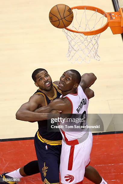 Tristan Thompson of the Cleveland Cavaliers competes for position in the third quarter with Bismack Biyombo of the Toronto Raptors in game four of...