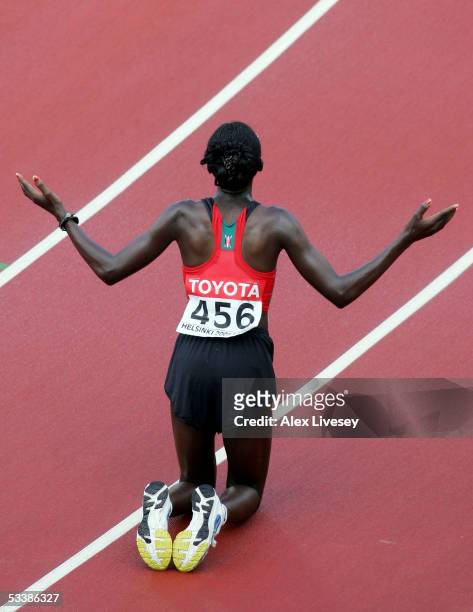 Catherine Ndereba of Kenya celebrates after she finished second in the women's marathon at the 10th IAAF World Athletics Championships on August 14,...
