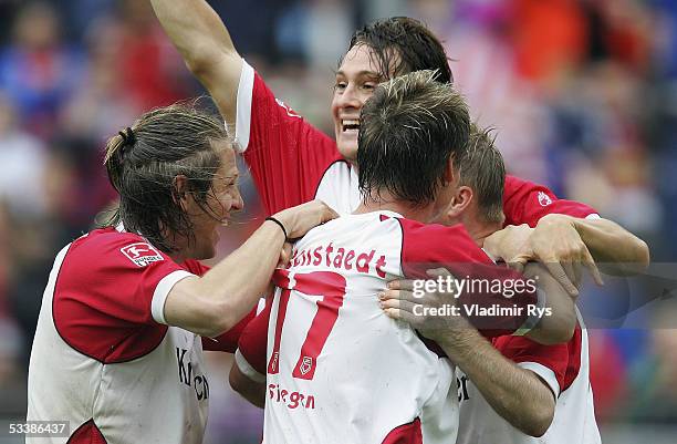 Daniel Bogusz of Siegen is congratulated by his teammates after scoring a goal during the Second Bundesliga match between Sportfreunde Siegen and...