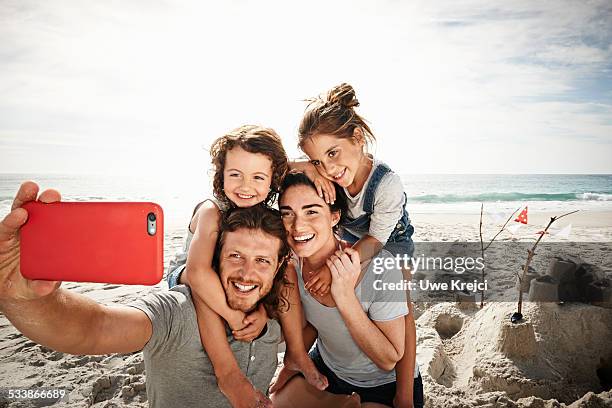 family taking self portrait on beach - beach selfie bildbanksfoton och bilder